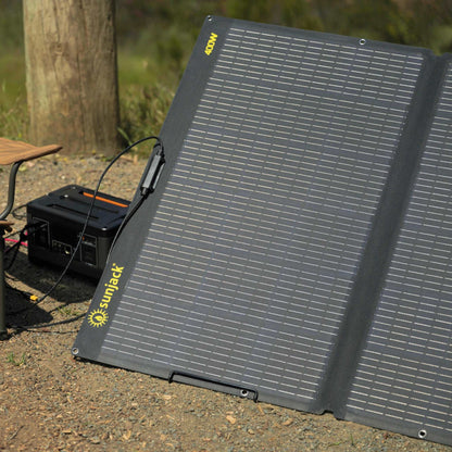 SunJack 400 Watt ETFE foldable solar panel charger with kickstand in outdoor setting.