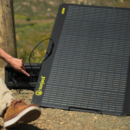 SunJack 400 Watt ETFE foldable solar panel charger with kickstand in outdoor setting.