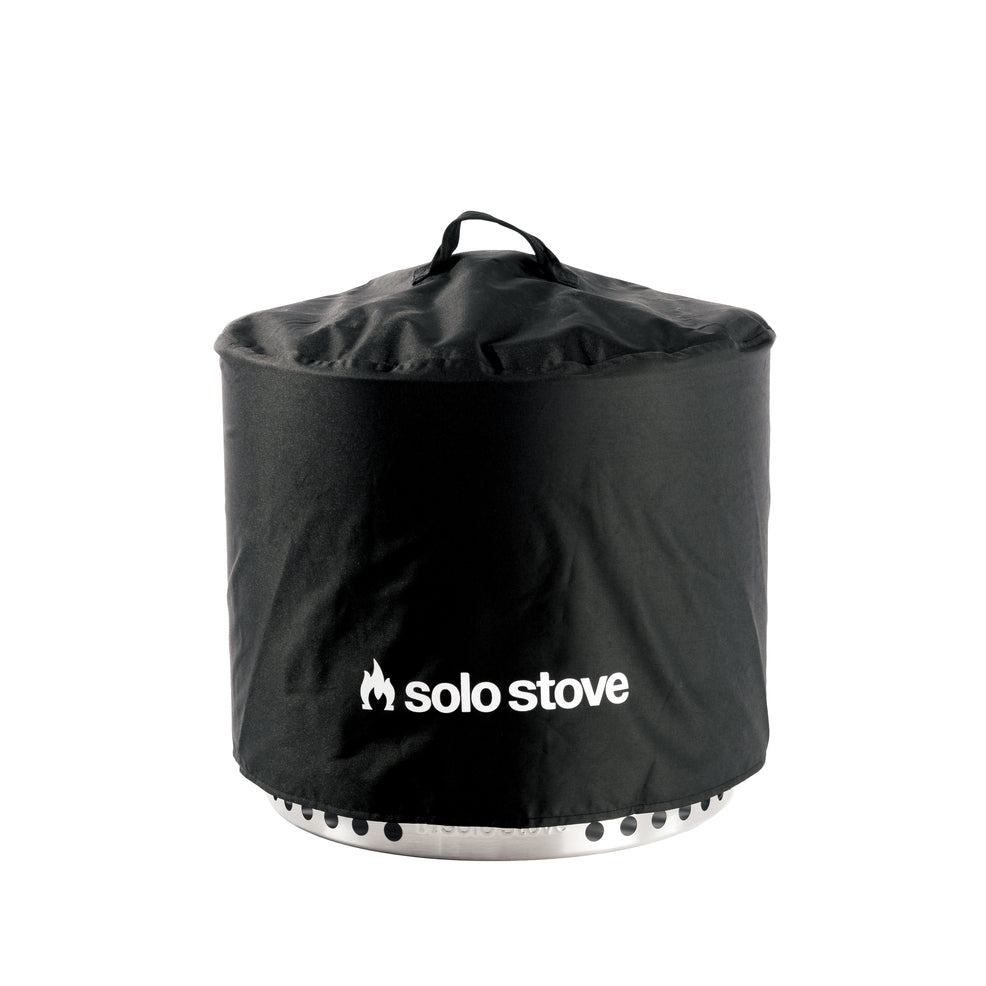 Waterproof round fire pit cover by Solo Stove with handle, gray PVC-coated polyester, protects against moisture.