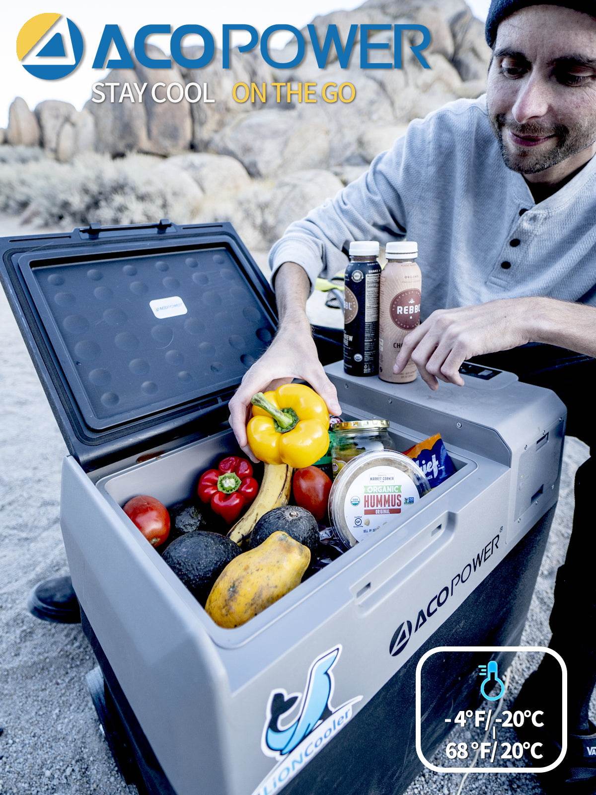 LionCooler X50A Portable Solar Fridge Freezer, 52 Quarts with fresh produce and drinks, outdoor setting.