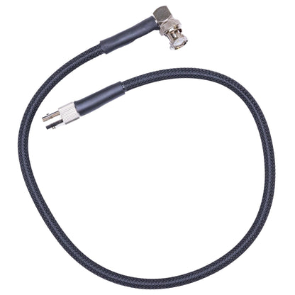 BNC antenna relocation cable with protective sleeve for tactical outdoor radio communication.