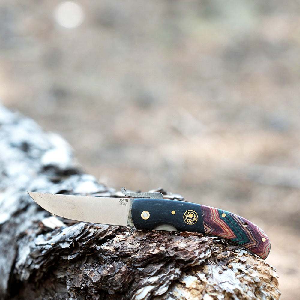 Kam Knife - KOC - N690 Steel with Micarta Handle on a Log, Ideal for Outdoor Adventures