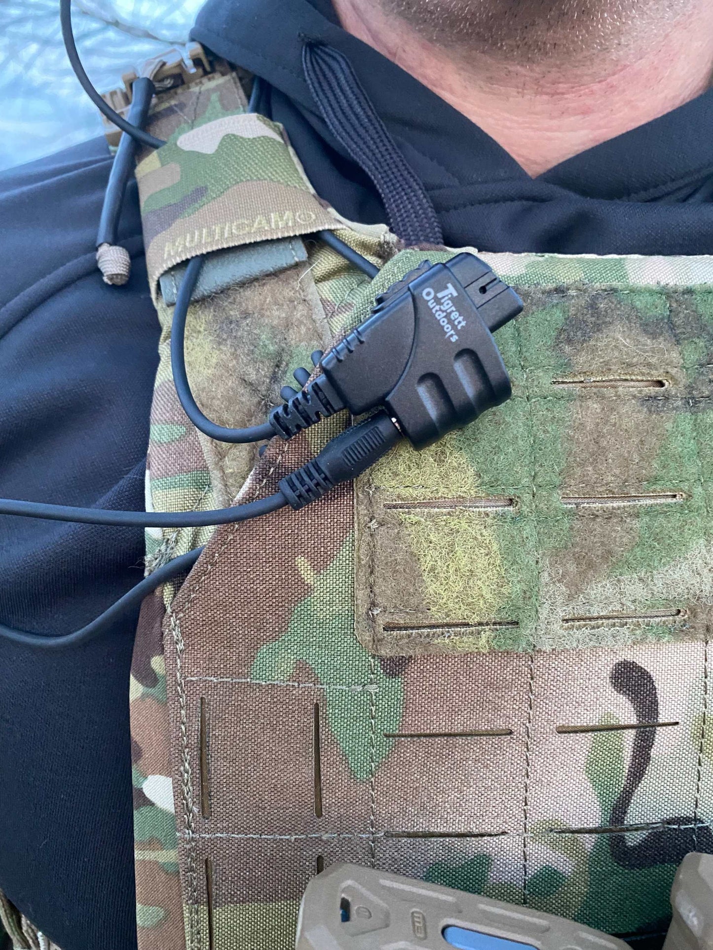 SMC radio cable on camo chest rig for Baofeng, Yaesu radios accessorizing electronic earmuffs.