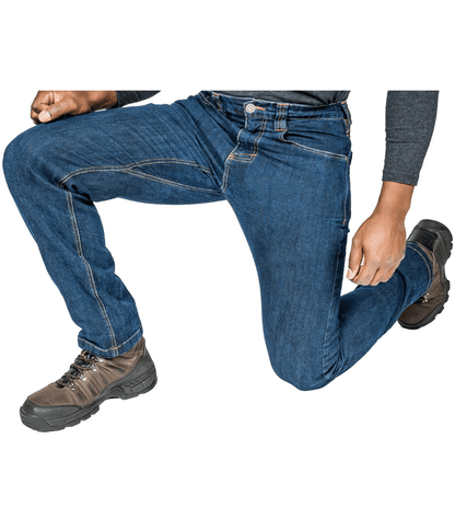 Man wearing Asset Tactical Jeans demonstrating flexibility and style, featuring advanced stretch technology and multiple pockets for EDC.