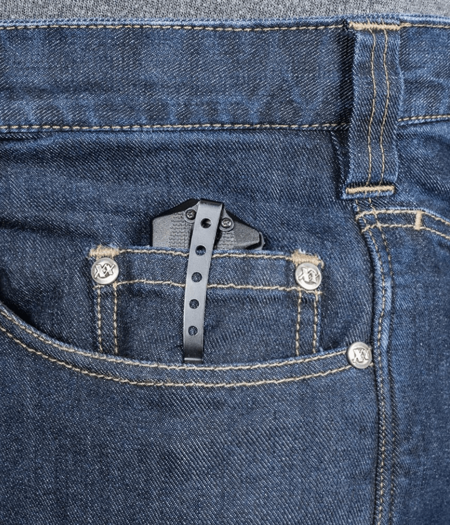 Asset Tactical Jeans showcasing a black pocket clip in denim fabric.