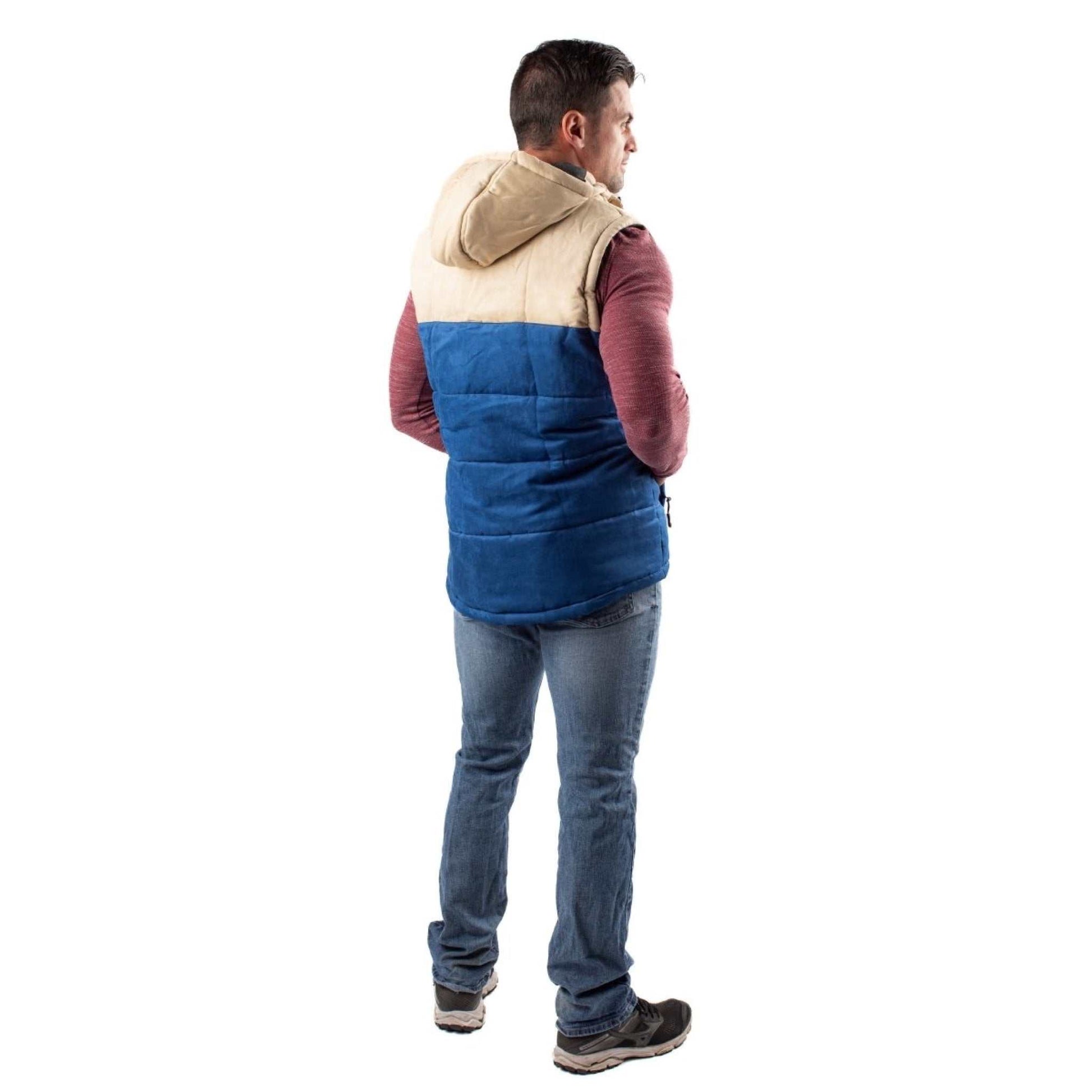 Man wearing Colt Mens Heated Vest with Hood in deep blue and cream Shoreline design, showcasing the vest's retro style and warmth.