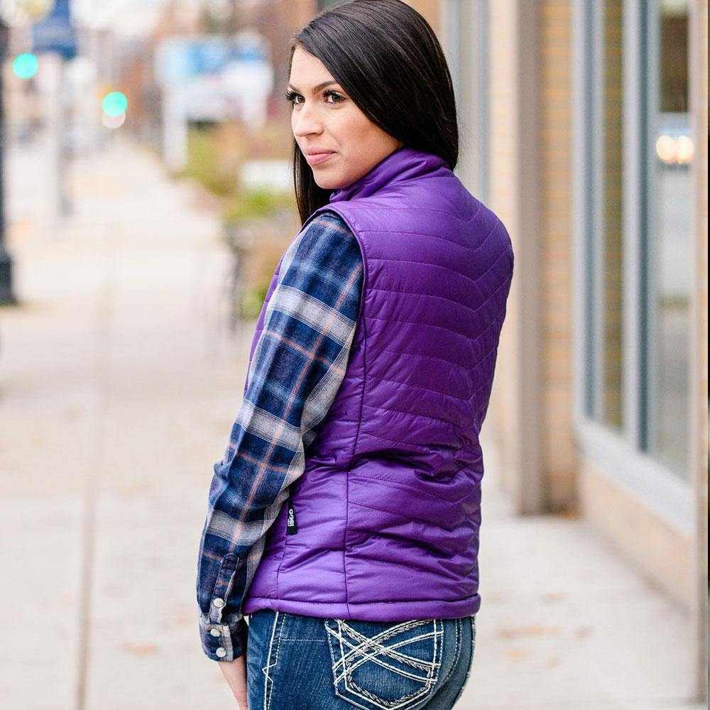 Purple Dune Heated Vest for Women on city street.