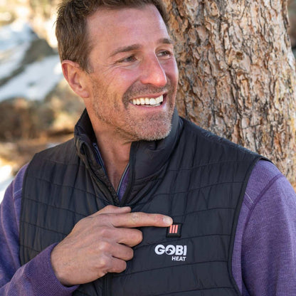 Dune Mens Heated Vest in black, lightweight and abrasion-resistant, provides 10 hours of warmth with adjustable heat settings.