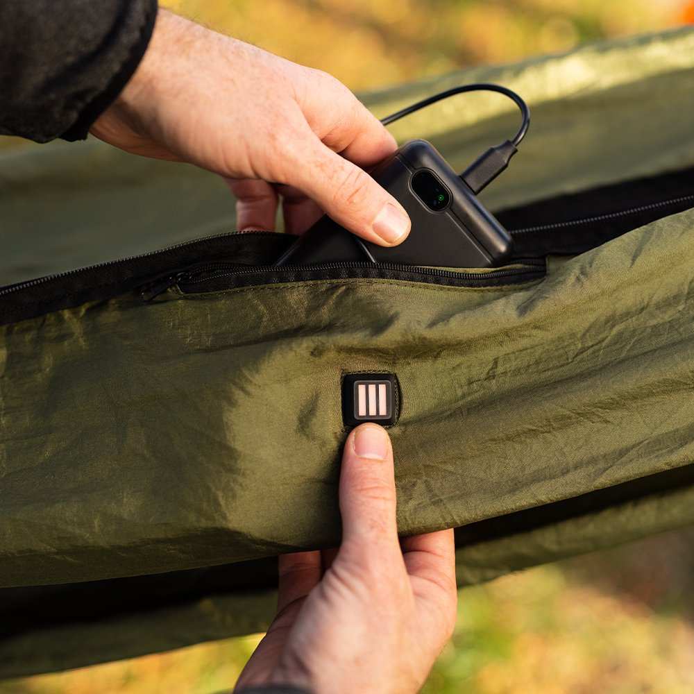 Eclipse Heated Hammock Tent with rechargeable battery setup in pine color.