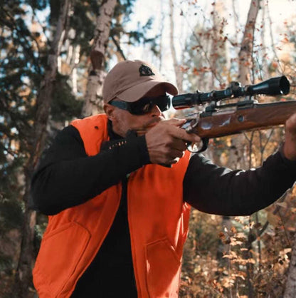 Man wearing the Equinoxx K2 Dyna-Thermal shirt while hunting in forest.