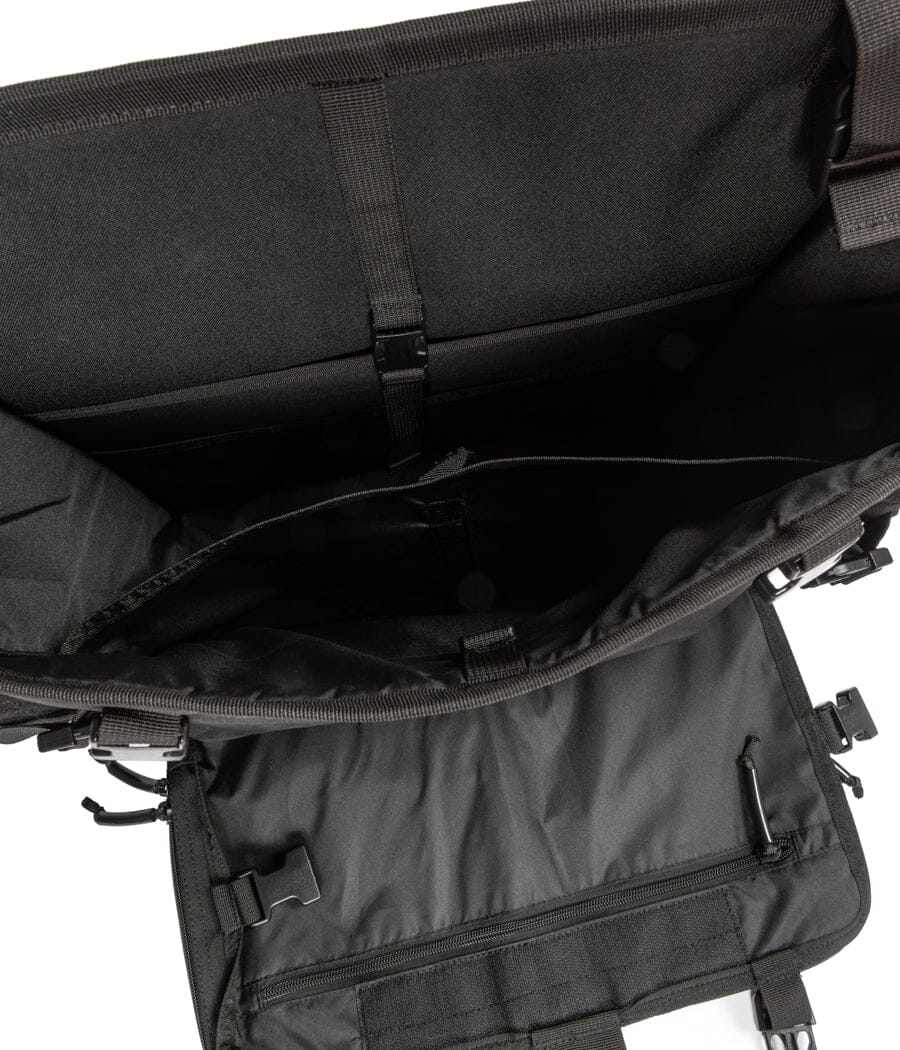 Interior view of Harlej Bag with multiple compartments and secure straps for vehicle organization.