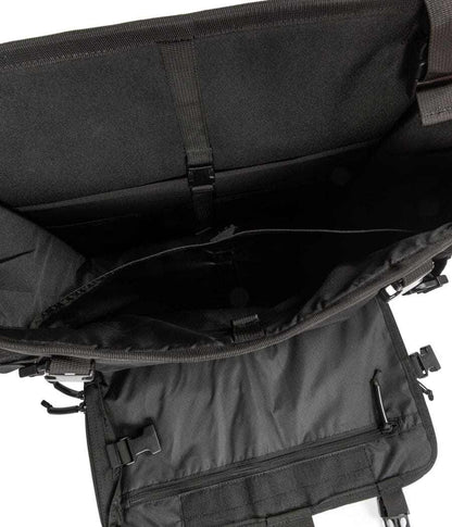 Interior view of Harlej Bag with multiple compartments and secure straps for vehicle organization.