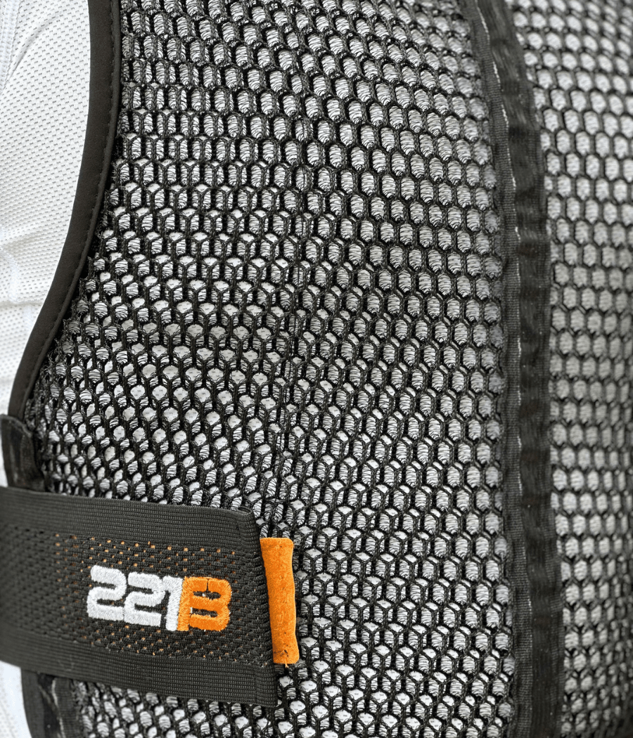 Maxx-Dri Vest 5.0 close-up showcasing mesh design and logo for enhanced ventilation.