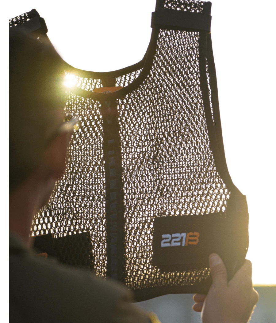 Maxx-Dri Vest 5.0 held up against sunlight, showcasing breathable mesh material.