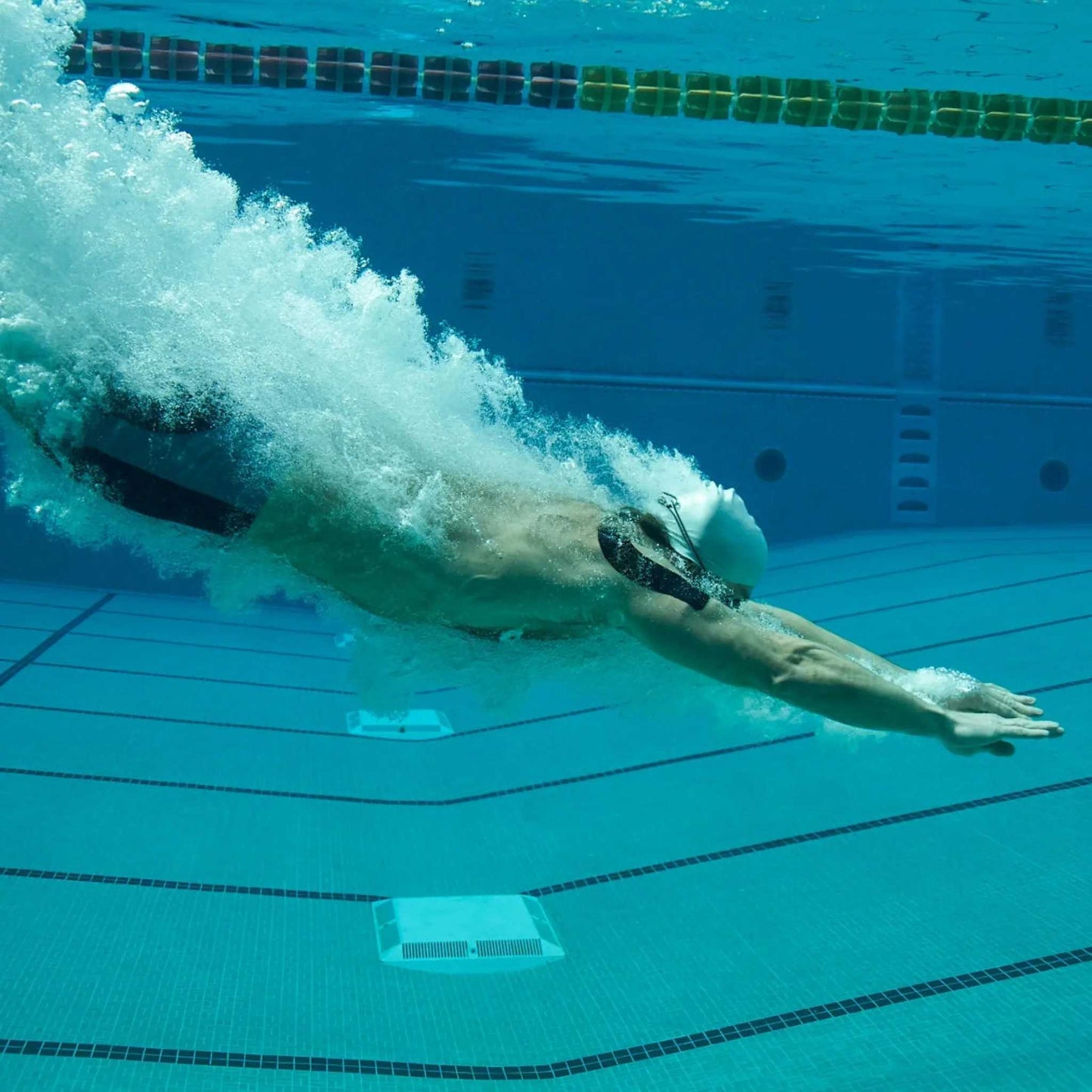 Swimmer using KT Tape Pro Extreme® in pool for support.