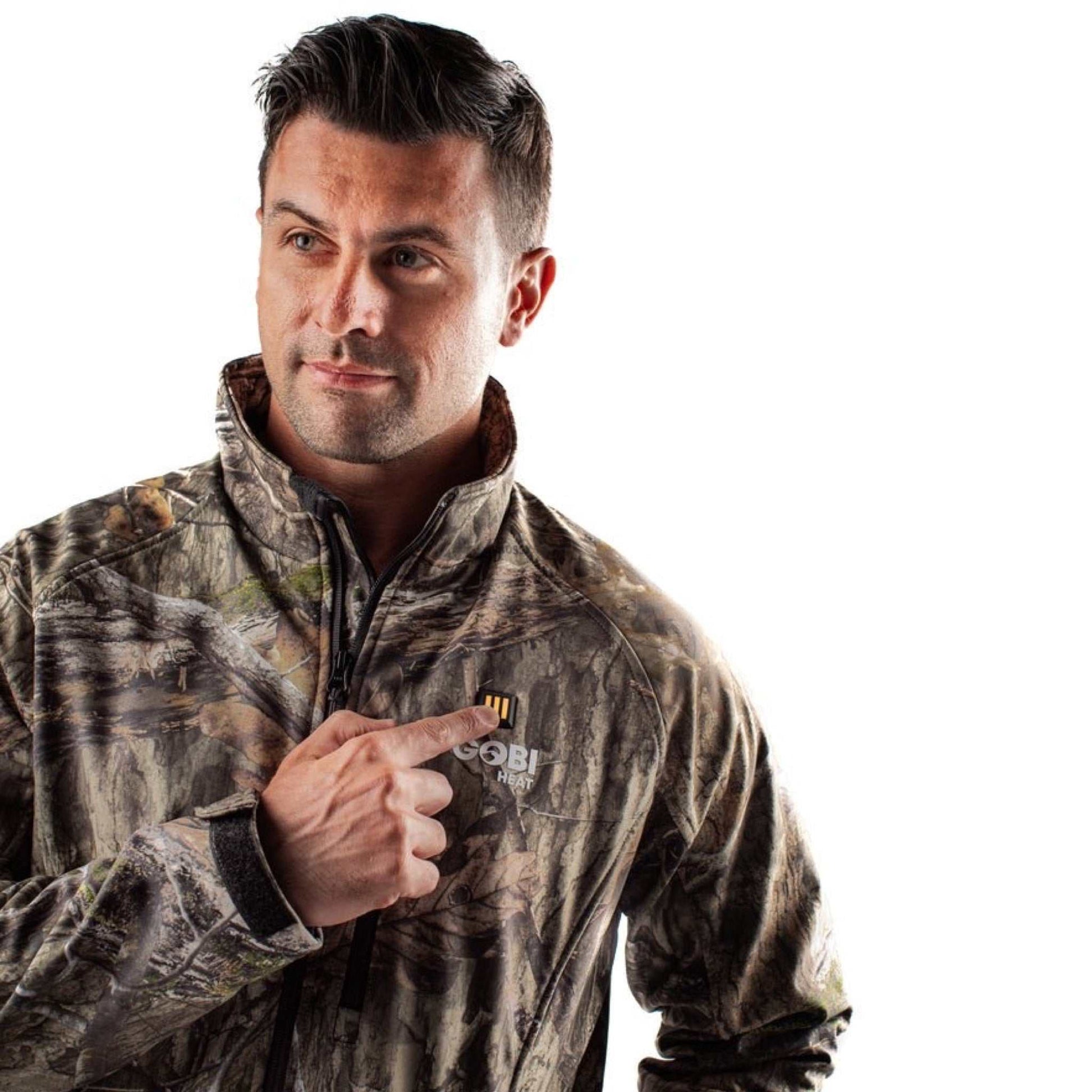 Sahara Heated Hunting Jacket in Mossy Oak Camo with adjustable heat settings.