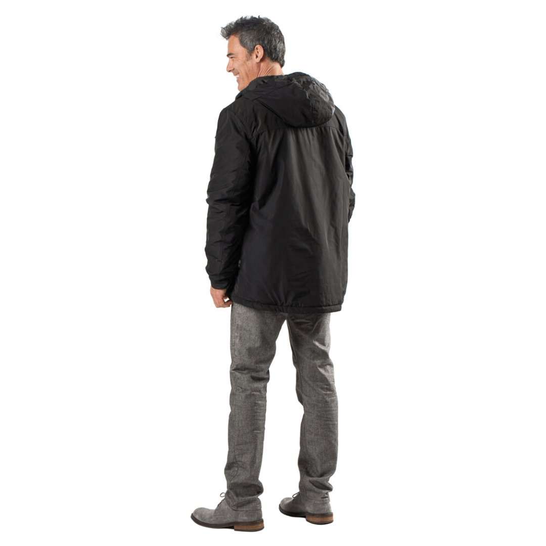 Man wearing black Shift Mens Heated Snowboard Jacket with hood.