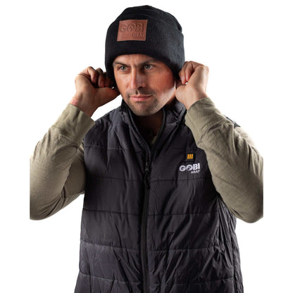 Summit Mens Heated Beanie with steel fiber heating, black color, worn by a model.