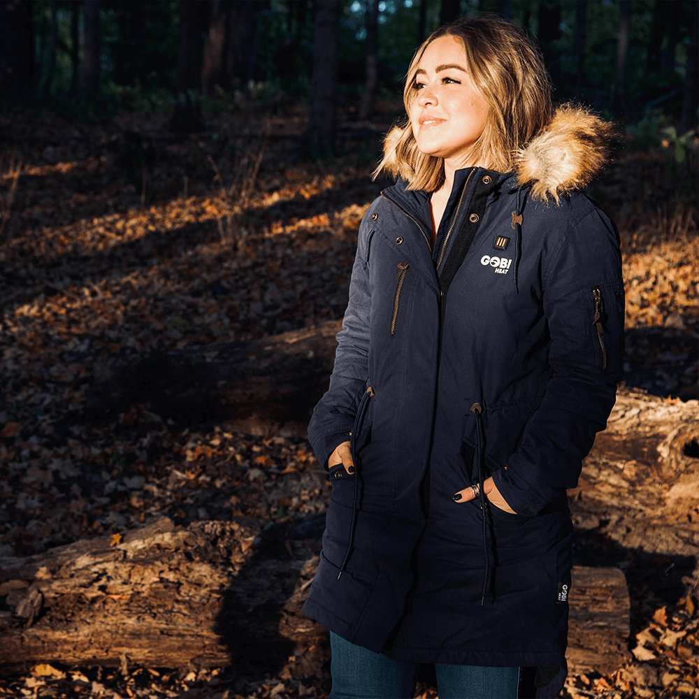 Terra Womens Heated Parka in Navy with drawstring hood and removable faux fur, featuring Gobi Heat's conductive threading system.