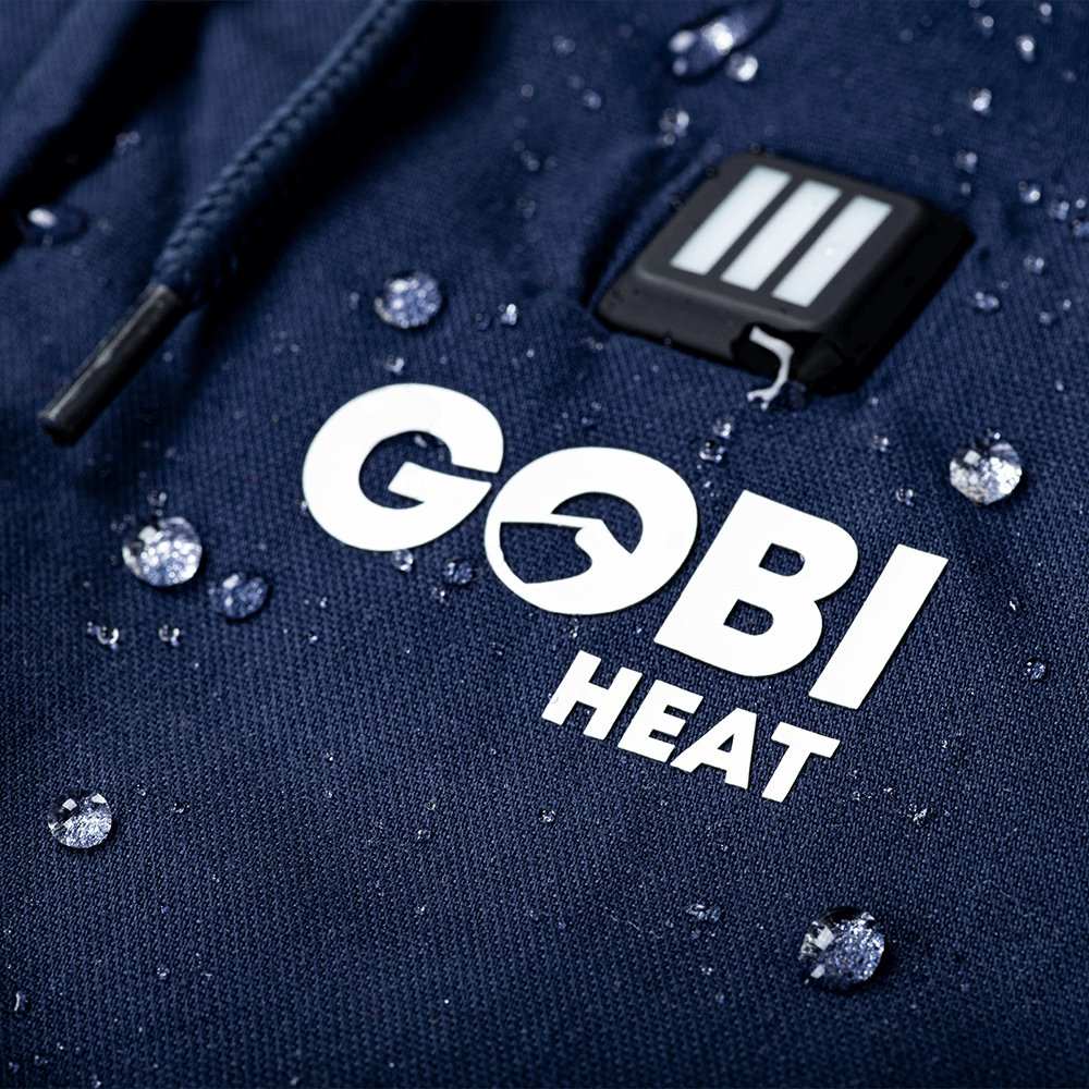 Navy Terra Womens Heated Parka with Gobi Heat logo and raindrop details.