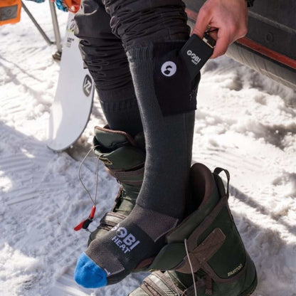 Tread Heated Socks with advanced heating elements, remote control, and rechargeable batteries for up to 12 hours of warmth.