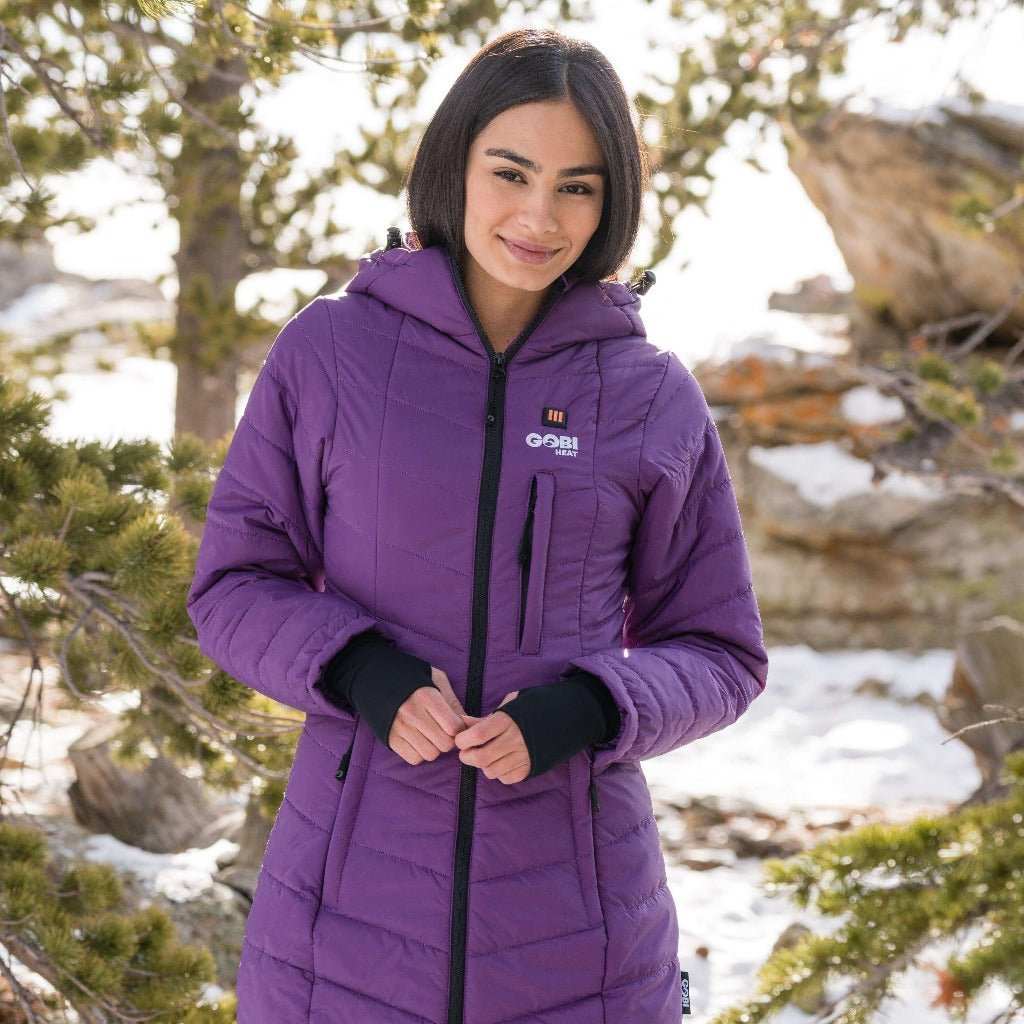 Victoria women's heated coat with hood, conductive thread heating, and lightweight nylon; offers 9 hours of warmth with 3 heat settings.