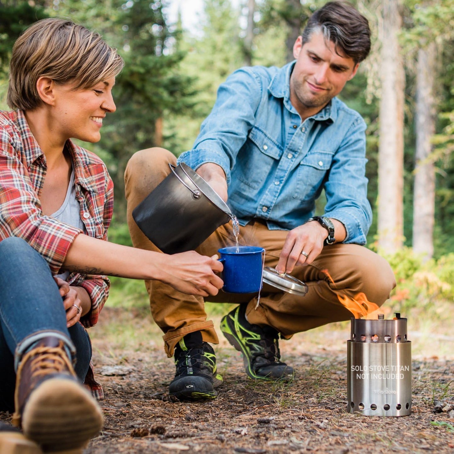 Campers using the Solo Stove Pot 1800 for outdoor cooking.